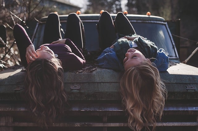 two friends on a classic car. Thanks for the fun memories